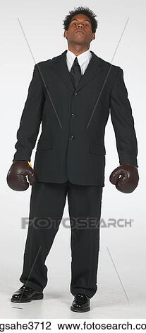 Businessman with boxing gloves View Large Photo Image Stock Image - Businessman with boxing gloves . Fotosearch