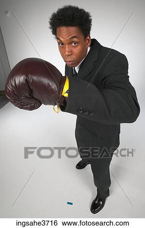 Businessman with boxing gloves View Large Photo Image Stock Photograph - Businessman with boxing gloves . Fotosearch