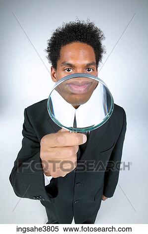 Businessman with magnifying glass  View Large Photo Image Stock Photography - Businessman with magnifying glass . Fotosearch