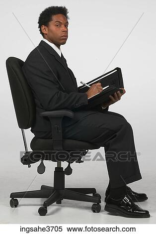 Businessman writing in folder View Large Photo Image Stock Photography - Businessman writing in folder . Fotosearch