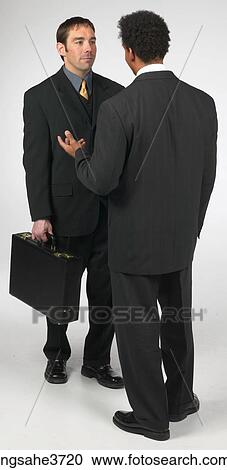Businessmen speaking View Large Photo Image Stock Image - Businessmen speaking . Fotosearch