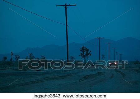 Car driving on dirt road at night View Large Photo Image Stock Image - Car driving on dirt road at night . Fotosearch