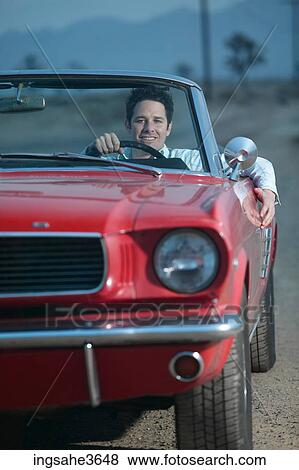 Car driving on dirt road at night View Large Photo Image Stock Photo - Car driving on dirt road at night . Fotosearch