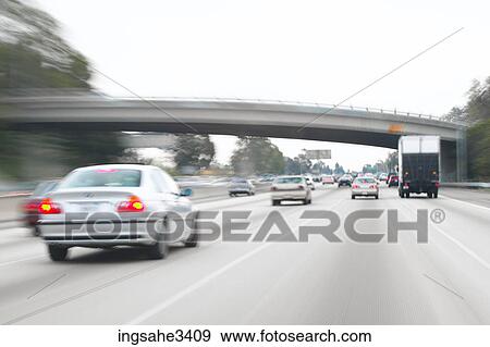 Cars and trucks on highway View Large Photo Image Stock Photo - Cars and trucks on highway . Fotosearch