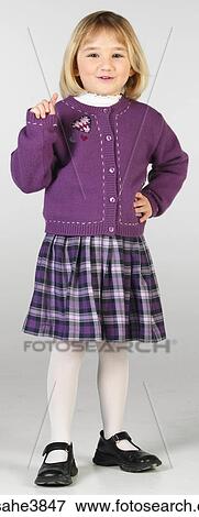 Caucasian blonde female child standing and pointing View Large Photo Image Stock Photo - Caucasian blonde female child standing and pointing. Fotosearch