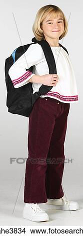 Caucasian blonde girl carrying a backpack View Large Photo Image Picture - Caucasian blonde girl carrying a backpack . Fotosearch