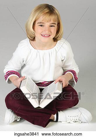 Caucasian blonde girl sitting cross legged View Large Photo Image Stock Image - Caucasian blonde girl sitting cross legged. Fotosearch
