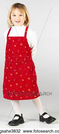 Caucasian female child standing and smiling View Large Photo Image Stock Image - Caucasian female child standing and smiling . Fotosearch
