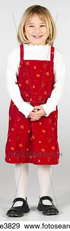 Caucasian female child standing and smiling View Large Photo Image Stock Photo - Caucasian female child standing and smiling . Fotosearch
