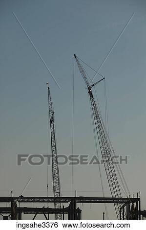 Construction cranes and girders View Large Photo Image Stock Photograph - Construction cranes and girders . Fotosearch