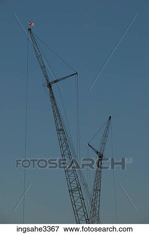 Construction cranes View Large Photo Image Stock Photo - Construction cranes . Fotosearch