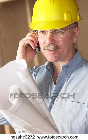 contractor looking at blue prints View Large Photo Image Stock Image - contractor looking at blue prints . Fotosearch