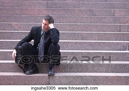 Dejected business sitting on steps View Large Photo Image Stock Photography - Dejected business sitting on steps . Fotosearch