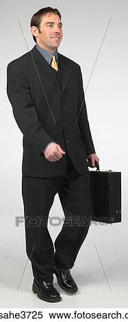Executive smiling and walking View Large Photo Image Stock Photography - Executive smiling and walking . Fotosearch