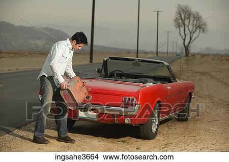Picture - Filing up car with gas . Fotosearch