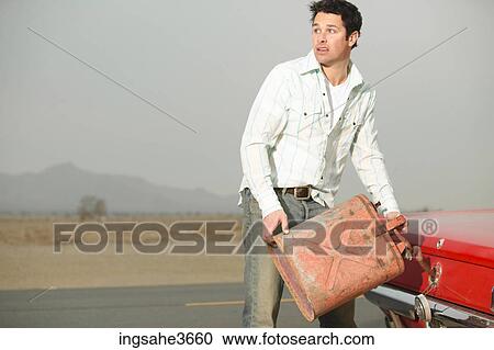 Filing up car with gas View Large Photo Image Stock Image - Filing up car with gas . Fotosearch
