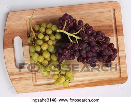 grapes on cutting board View Large Photo Image Stock Photo - grapes on cutting board . Fotosearch