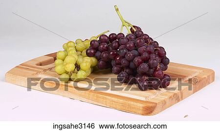 grapes on cutting board View Large Photo Image Stock Photograph - grapes on cutting board . Fotosearch