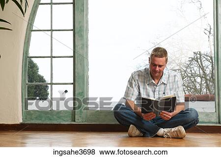 Male young adult sitting in chair View Large Photo Image Stock Photo - Male young adult sitting in chair . Fotosearch