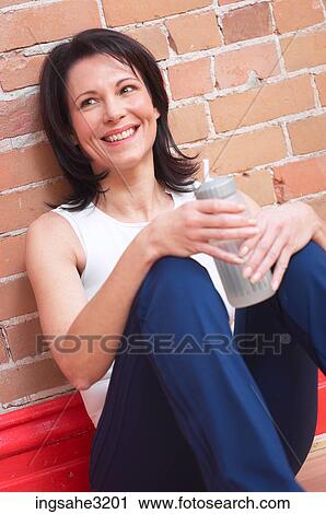 Mature adult woman smiling with water bottle View Large Photo Image Stock Image - Mature adult woman smiling with water bottle . Fotosearch