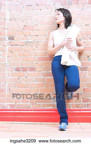 Mature adult woman smiling with water bottle and towel View Large Photo Image Stock Photo - Mature adult woman smiling with water bottle and towel . Fotosearch