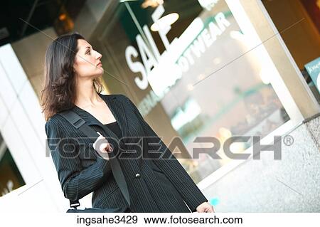 Mature female adult window shopping View Large Photo Image Stock Photo - Mature female adult window shopping . Fotosearch