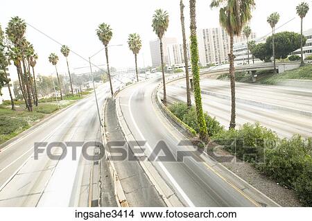 Palm tree lined highway View Large Photo Image Picture - Palm tree lined highway . Fotosearch