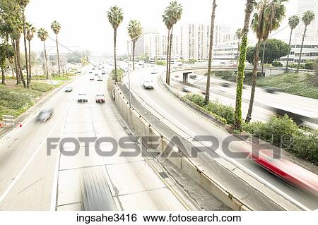 Palm tree lined highway View Large Photo Image Stock Photograph - Palm tree lined highway . Fotosearch