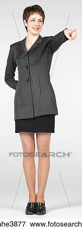 Pointing businesswoman in grey suit View Large Photo Image Stock Photo - Pointing businesswoman in grey suit. Fotosearch