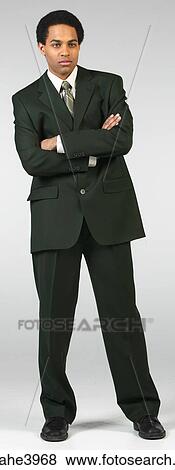 Serious businessman in black suit View Large Photo Image Stock Photo - Serious businessman in black suit . Fotosearch