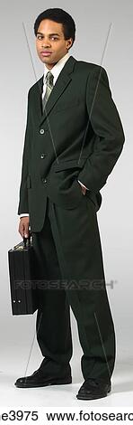 Serious businessman in black suit with briefcase View Large Photo Image Stock Photography - Serious businessman in black suit with briefcase. Fotosearch