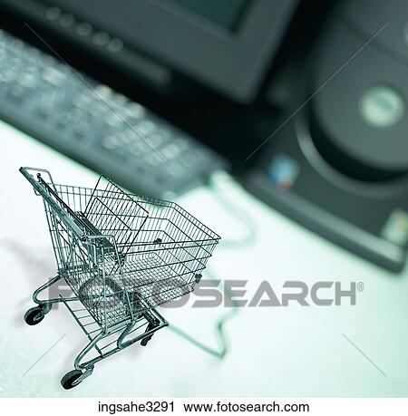 Shopping cart and computer View Large Photo Image Stock Image - Shopping cart and computer . Fotosearch