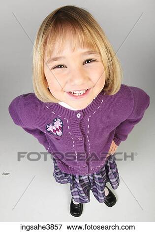 Smiling little girl in purple skirt and sweater View Large Photo Image Stock Photo - Smiling little girl in purple skirt and sweater. Fotosearch