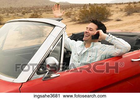 Smiling male young adult driving car View Large Photo Image Stock Image - Smiling male young adult driving car . Fotosearch