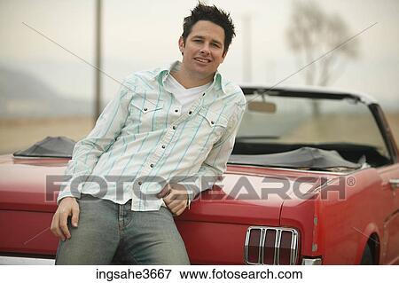 Stock Photo - Standing next to car . Fotosearch