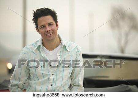 Standing next to car View Large Photo Image Stock Photo - Standing next to car . Fotosearch