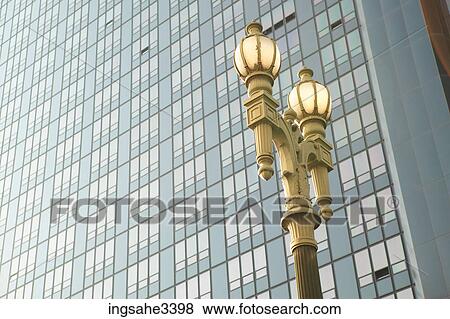 Stock Photo - Streetlight against side of building . Fotosearch
