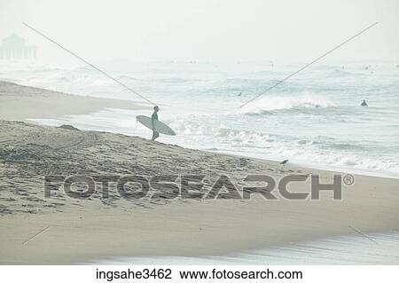 Surfer looking at wave View Large Photo Image Stock Image - Surfer looking at wave . Fotosearch