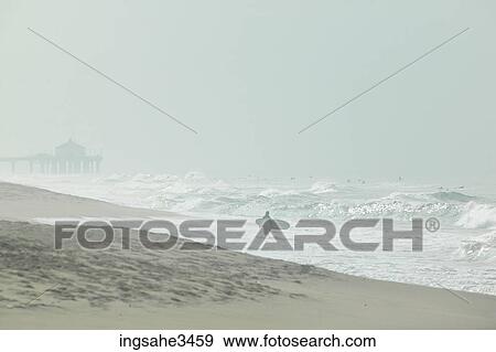 Stock Photo - Surfer looking at wave . Fotosearch