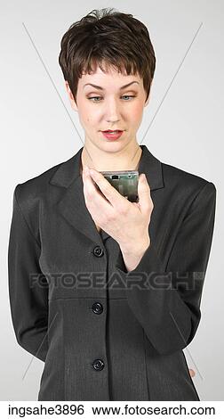Surprised businesswoman holding PDA View Large Photo Image Stock Photograph - Surprised businesswoman holding PDA . Fotosearch