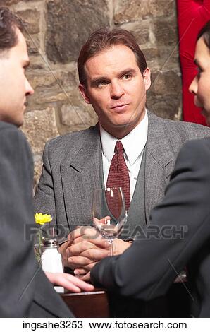 Three business people at meeting View Large Photo Image Stock Image - Three business people at meeting . Fotosearch
