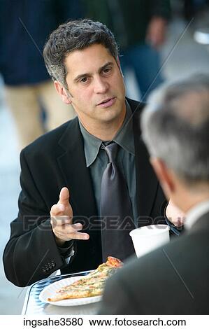 Two business men at lunch talking View Large Photo Image Stock Image - Two business men at lunch talking . Fotosearch