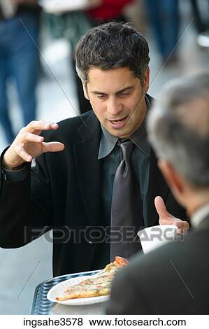 Two business men at lunch talking View Large Photo Image Stock Photo - Two business men at lunch talking . Fotosearch