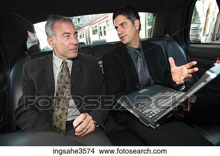 Two business men in car View Large Photo Image Picture - Two business men in car . Fotosearch