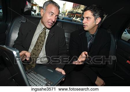 Two business men in car View Large Photo Image Stock Image - Two business men in car . Fotosearch