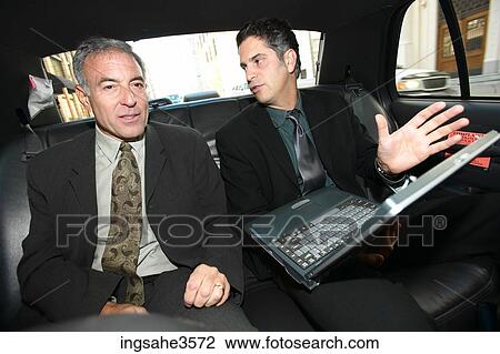 Two business men in car View Large Photo Image Stock Image - Two business men in car . Fotosearch