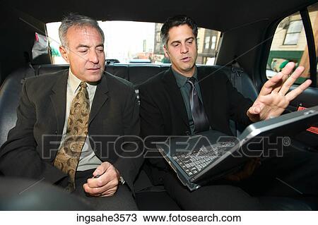 Two business men in car View Large Photo Image Stock Image - Two business men in car . Fotosearch