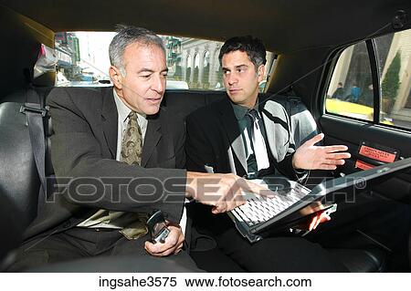 Two business men in car View Large Photo Image Stock Photography - Two business men in car . Fotosearch