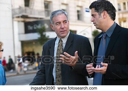 Two business men walking View Large Photo Image Stock Image - Two business men walking . Fotosearch