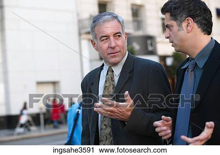 Two business men walking View Large Photo Image Stock Image - Two business men walking . Fotosearch